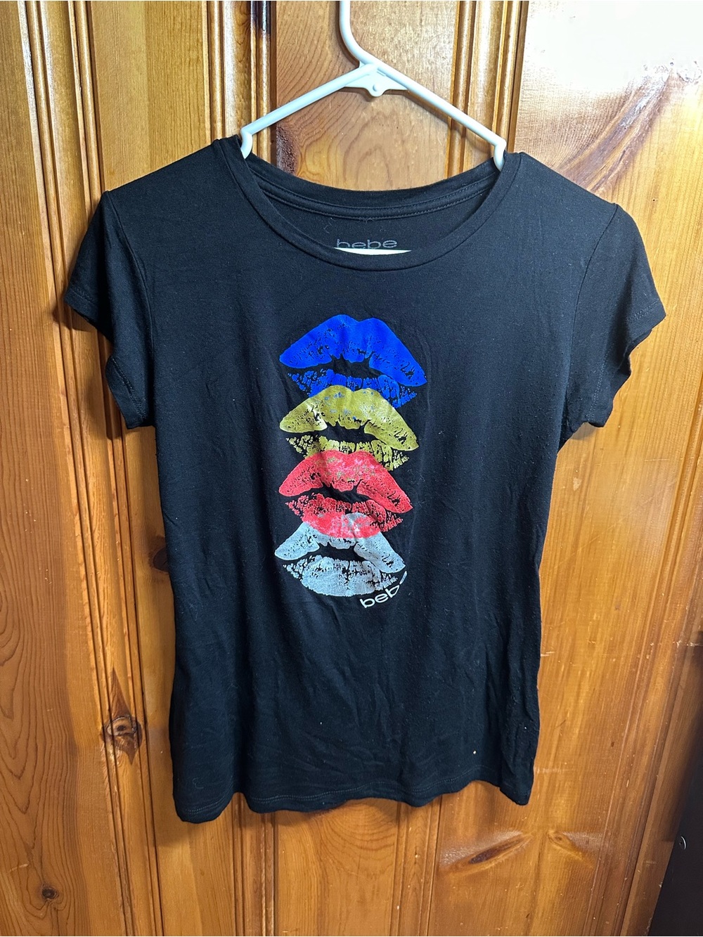 bebe Black Tee with Blue, Yellow, Red & White Lip Stack